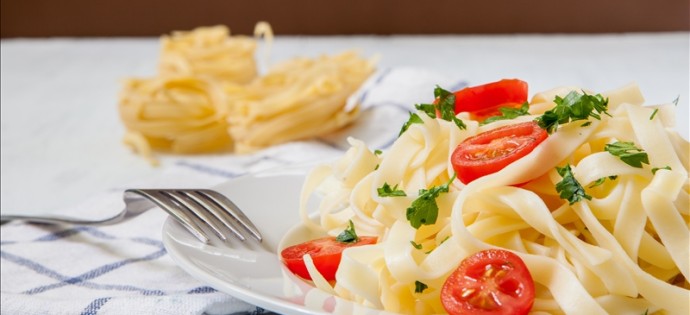 italian pasta tagliatelle with tomato and cheese sauce